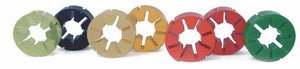 Stjärnformade kopplingselement i gul, svart, beige, orange, röd och grön för elastiska kopplingsapplikationer.